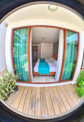 Standard Quadruple Room, Pool View | Minibar