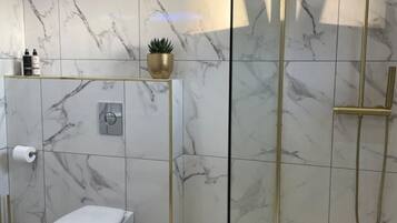 Shower, free toiletries, hair dryer, towels