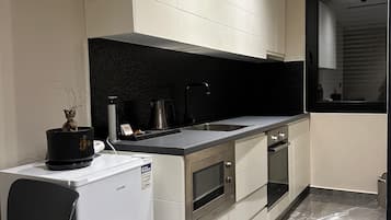 Appartamento familiare | Cucina privata | Mini-frigorifero, microonde, piano cottura, bollitore elettrico