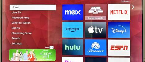 A TCL Roku TV displaying a variety of streaming service logos.