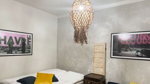 A bedroom with a bed, a desk, and two framed pictures on the wall. - Central stay in Helsinki (Helsinki)