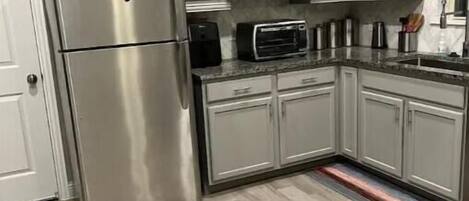 Fridge, microwave, coffee/tea maker, toaster