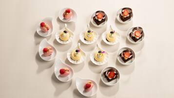 A collection of dessert items arranged on a table.