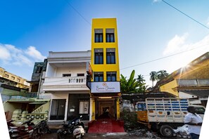 A two-story building with a yellow facade and a sign that reads "Barne Chance Heritage Residence." - Bonne Chance Heritage Residence (Puducherry)