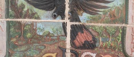 A mosaic with a bird and landscape.