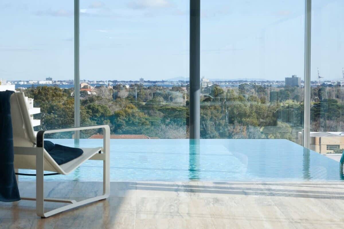 A modern infinity pool with a clear view of the cityscape.