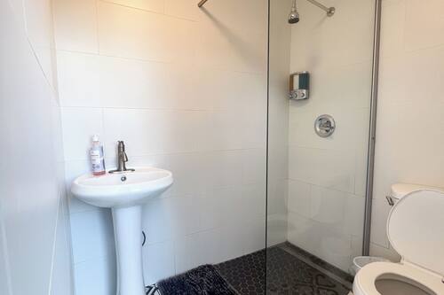 Shower, rainfall showerhead, towels, soap