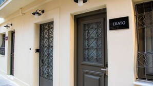 A building facade with two doors, one labeled "ERATO" and the other with a decorative metal design. - Athens Muses Suites (Athens)