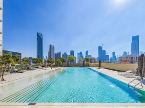 Outdoor pool - Lavishly Elegant 2BR with Breathtaking Burj View (Dubai)