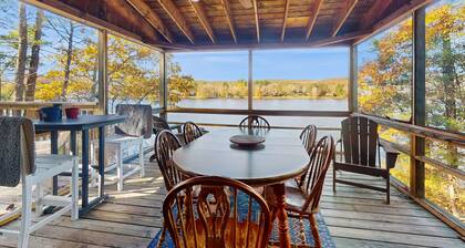 Lakefront home near ski resorts with water view, dock, deck, fireplaces, & W/D