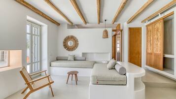 Elite Suite, 1 Bedroom | Living area | 42-inch LED TV with cable channels, fireplace, Netflix