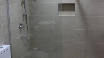 Shower, rainfall showerhead, hair dryer, towels