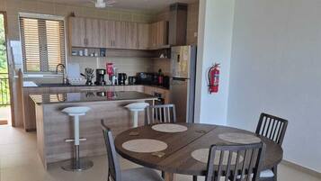 Deluxe Apartment, Ocean View, Mountainside | Private kitchen | Full-sized fridge, microwave, oven, dishwasher