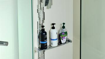 Shower, hair dryer, towels, soap