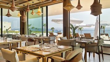 Breakfast, lunch, dinner served; beach views