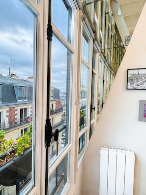 Enjoy the city views from the spacious balcony with an outdoor space.