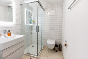 Shower, hair dryer, towels, soap