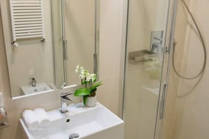 Shower, eco-friendly toiletries, hair dryer, bidet