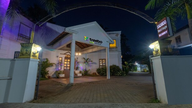 A building with a sign reading "SADHOO Heritage Resort" and "treebo trend". - Treebo Sadhoo Heritage (Kannur)