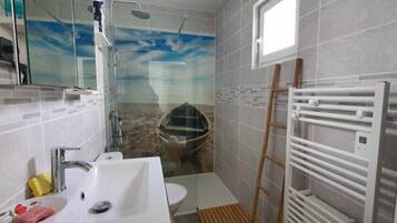 Shower, hair dryer, towels, soap