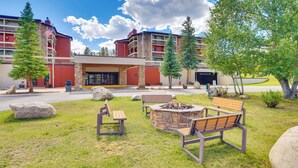 A hotel with outdoor seating, a fire pit, and a stone fireplace. - Easy Ski Shuttle Access! Winter Park Mtn Getaway (Winter Park)