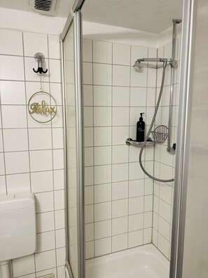 Shower, hair dryer, towels, soap