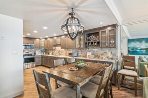 Prepare meals and socialize in this spacious kitchen with a large island and sleek cabinetry.