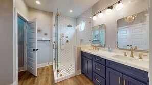 Shower, hair dryer, towels, toilet paper