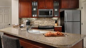 Microwave, stovetop, dishwasher, cookware/dishes/utensils
