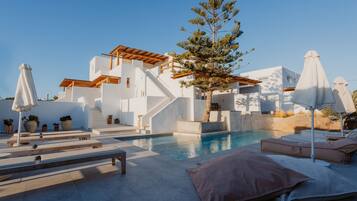 Seasonal outdoor pool, pool umbrellas, pool loungers