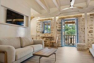 Deluxe Suite, Sea View | Living area | 43-inch Smart TV with cable channels, Netflix, streaming services