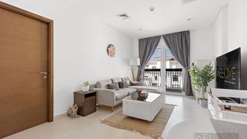 Elite Apartment | Living area | 55-inch Smart TV with cable channels, Netflix, streaming services