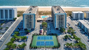 A multi-story hotel with a tennis court, parking, and a beach view. - Ocean View North OC Oasis - Braemar Towers (Ocean City)