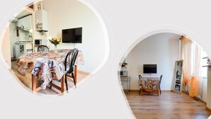 Un coin repas avec une table dressée pour quatre personnes, un téléviseur à écran plat fixé au mur et une cuisine visible au fond.