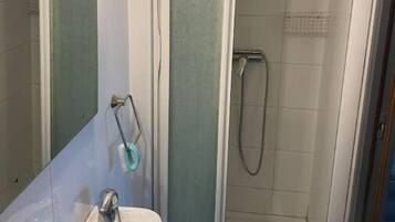 Shower, towels, soap, toilet paper