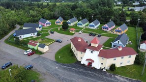 Stroll through a charming neighborhood with a variety of homes, lush lawns, and a central community center.