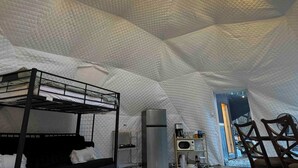 An igloo-style room with a bunk bed, a kitchenette, and a view of the outdoors. - The Perch: Glamping by Rafting (Cosby)
