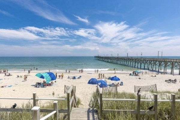 On the beach, sun loungers, beach towels