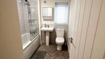 Combined shower/bathtub, deep-soaking bathtub, towels