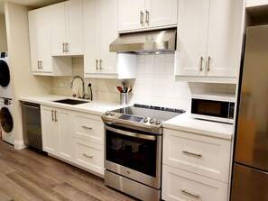Fridge, microwave, oven, stovetop - Designer-renovated 1 bedroom in Roncesvalles Village (Toronto)