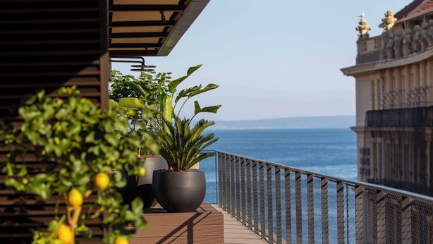 A balcony with potted plants and a view of the sea. - Keight Hotel Opatija, Curio Collection By Hilton (Opatija)
