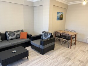 Deluxe Condo | Living area | 32-inch LED TV with satellite channels - Sleep House Kadikoy (Istanbul)