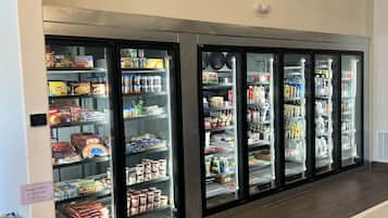 A refrigerated display case with various food items and beverages.
