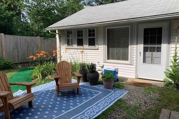 Guest House entrance and comfy Adirondack chairs for your enjoyment