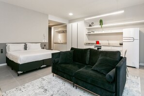 Grand Studio | Living area | 32-inch TV with digital channels