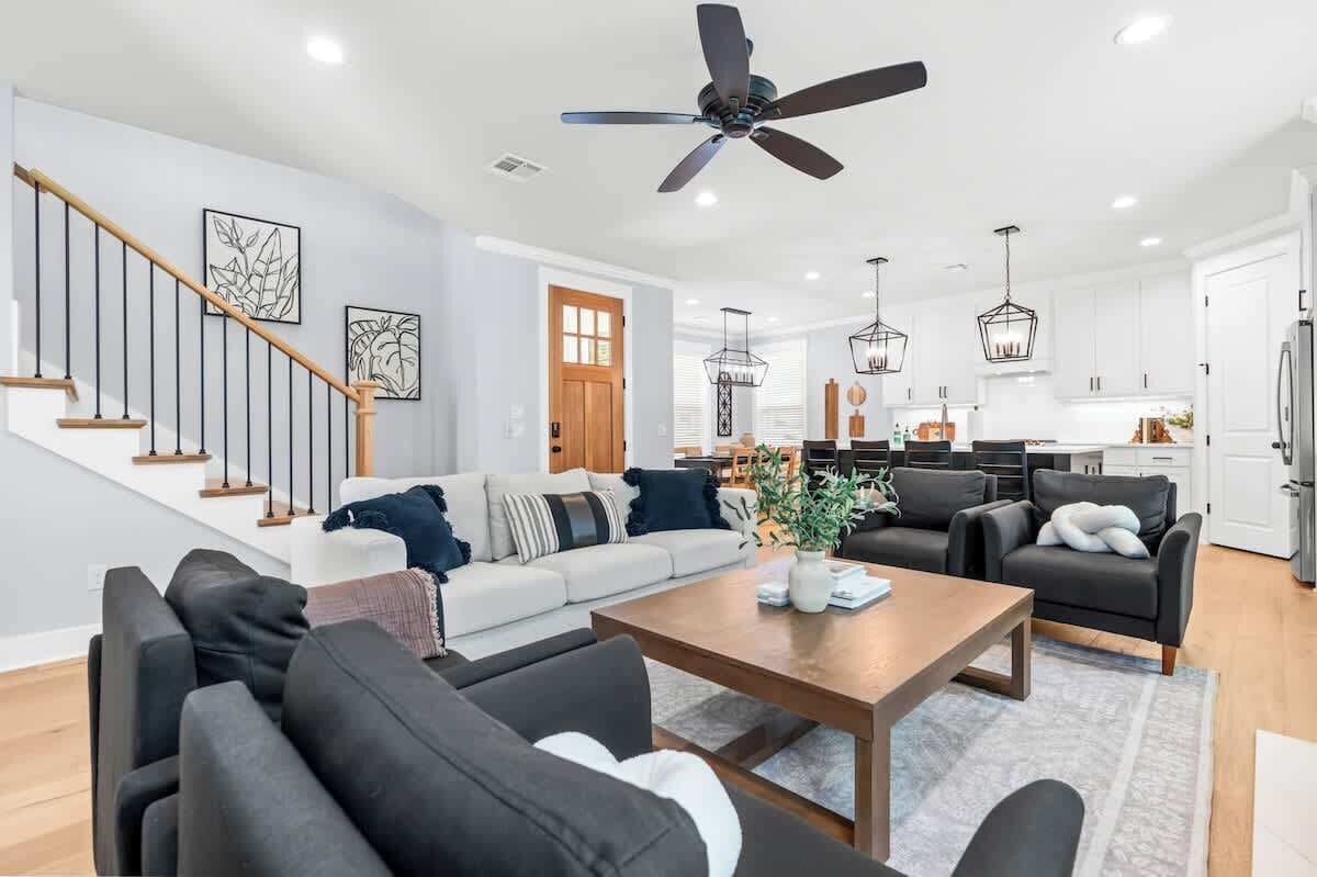 This spacious and stylish living room seats seven adults.