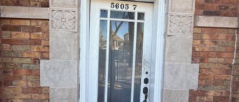 A white door with the number 5605.