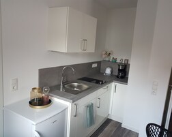 Comfort Studio, Balcony, Courtyard Area | Private kitchen | Full-size fridge, microwave, stovetop, electric kettle