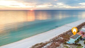 An aerial view of a beach with a clear sky, a sunset, and a hotel icon indicating the location. - Beachfront, Pool, Amazing Views, and Sleeps 14 (Panama City Beach)