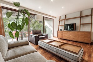 Business Apartment | Living area | 40-inch Smart TV with digital channels, Netflix, streaming services